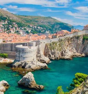a view of a river with a city in the background