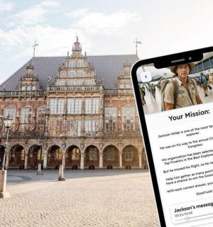 a cell phone in front of a large building