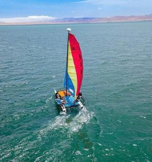 a person on a sail boat in the water