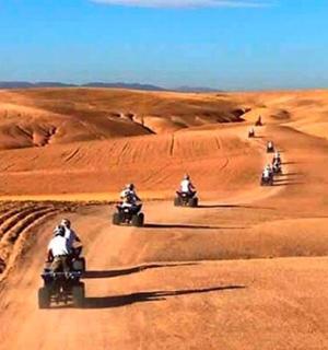 a group of people riding motorcycles in the desert