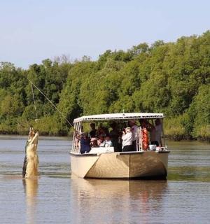 a group of people on a boat in the water