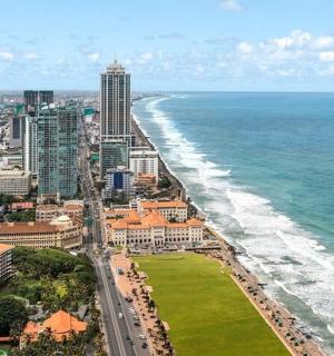 an aerial view of a city and the ocean