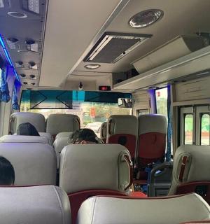 a group of people sitting on a bus