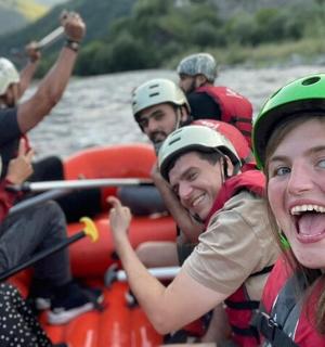 a group of people on a raft on a river