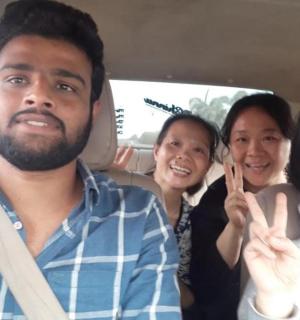 a group of people sitting in the back of a car
