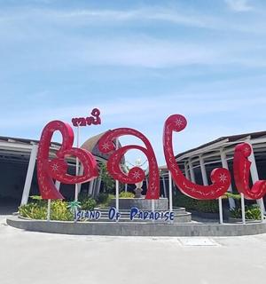 a large red sign in front of a building