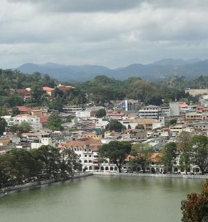 a view of a city with a river and a town