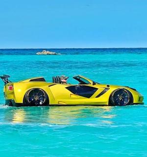 a yellow car in the water in the ocean