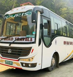 a white bus parked on a dirt road