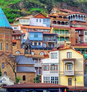 a group of buildings with a church and a tower