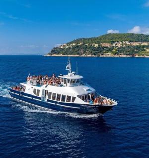 a group of people on a boat in the water
