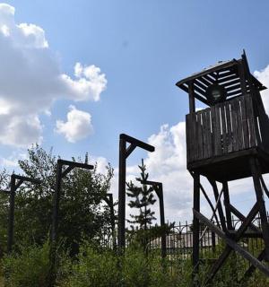 a sculpture of a chair on top of a fence