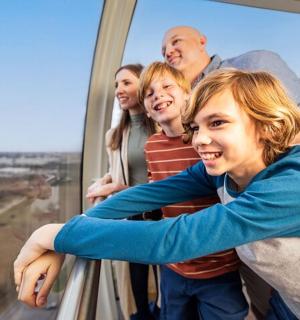 a family posing for a picture in a tower