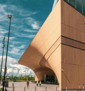 a building with people walking in front of it