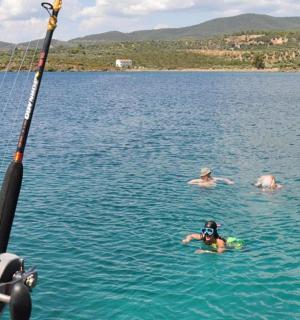 a group of people swimming in a lake