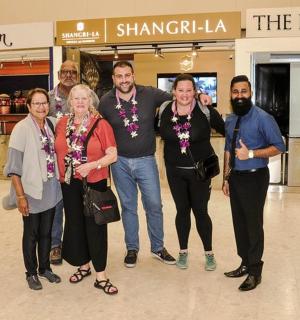 a group of people standing in a shopping mall