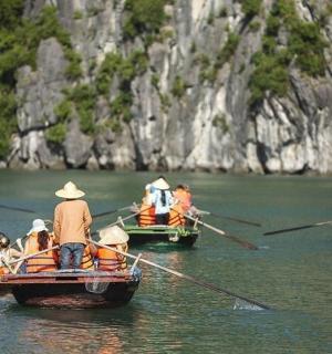 a group of people in boats in the water