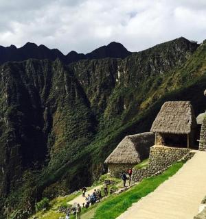 a group of people standing on top of a mountain