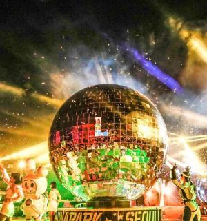 a disco ball in front of a crowd of people