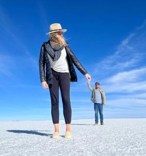 a woman and a man standing in the desert