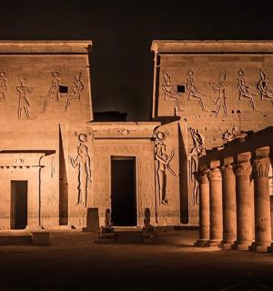 a building with writing on the side of it at night