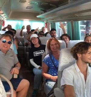 a group of people sitting on a bus