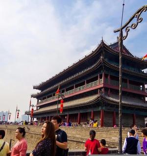 a group of people standing in front of a building