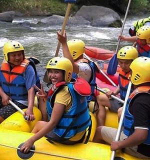 a group of people rafting down a river