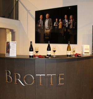 a bar with bottles of wine on top of it