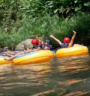a group of people in rafts on a river
