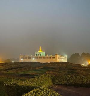 a large white building with a gold roof