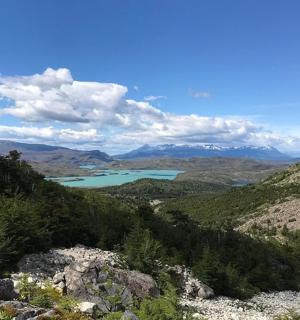 a view of a lake in the middle of a mountain