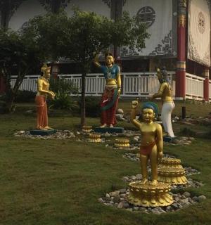 a group of statues in front of a building