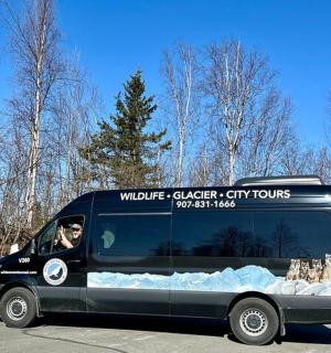 a black van with snow on the side