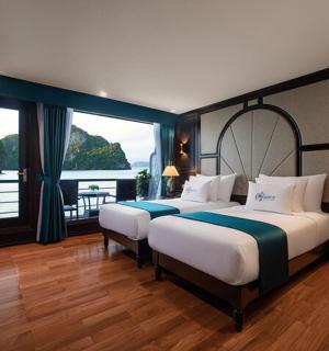 a bedroom with two beds and a large window