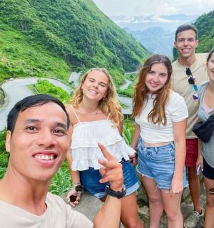 a group of people standing on the side of a mountain