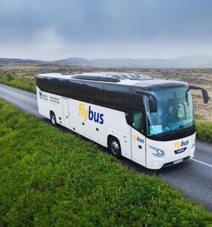 a bus is driving down a road