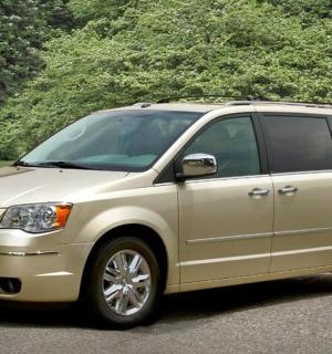a tan van parked in a parking lot