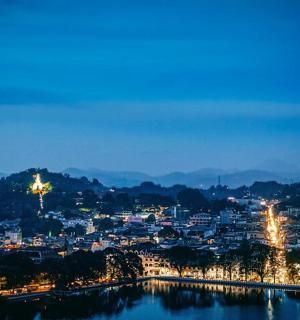 a view of a city at night with a river
