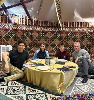 a group of men sitting around a table