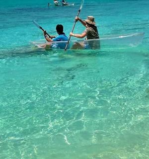 two people are in a boat in the water