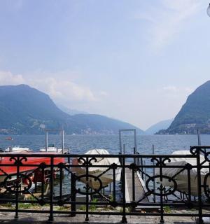 a table and chairs in front of a body of water
