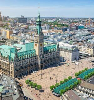an aerial view of a city with a clock tower