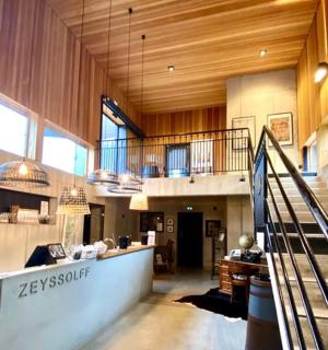 a large lobby with a staircase in a building