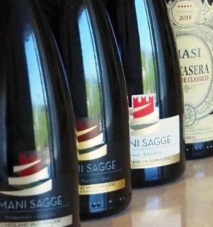 three bottles of wine sitting on a table