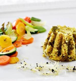 a plate of food with vegetables and a piece of meat