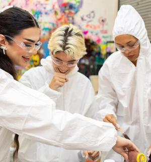 a group of women in white outfits in a store