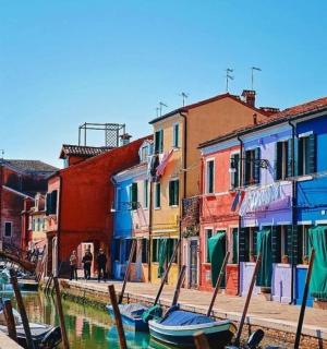 a group of colorful buildings with a clock tower