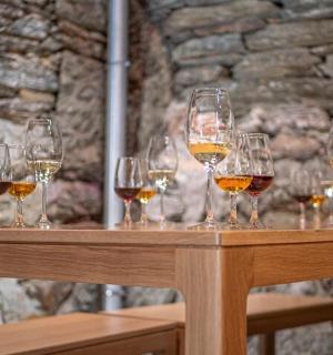 a group of wine glasses sitting on a table