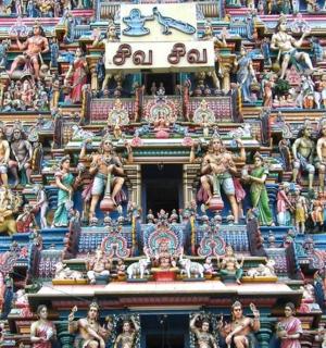 a group of figurines on the side of a building